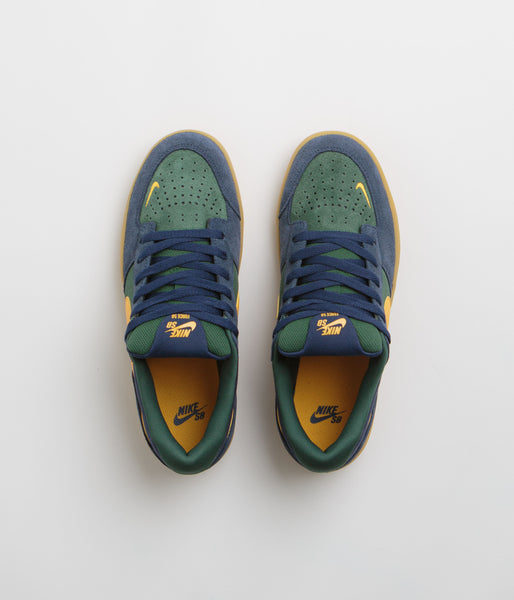 Navy blue and green nike shoes on sale