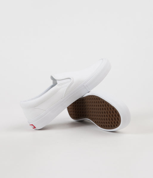 Tumble white slip on on sale vans