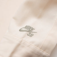 Nike SB New Essential Woven Shirt - Guava Ice / Neutral Olive thumbnail