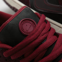 Nike SB x RIOT Skateshop Dunk Low Pro Shoes - Mahogany / Dark Beetrot - Team Red - Sail thumbnail