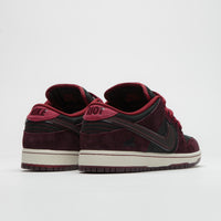 Nike SB x RIOT Skateshop Dunk Low Pro Shoes - Mahogany / Dark Beetrot - Team Red - Sail thumbnail