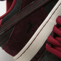 Nike SB x RIOT Skateshop Dunk Low Pro Shoes - Mahogany / Dark Beetroot - Team Red - Sail thumbnail